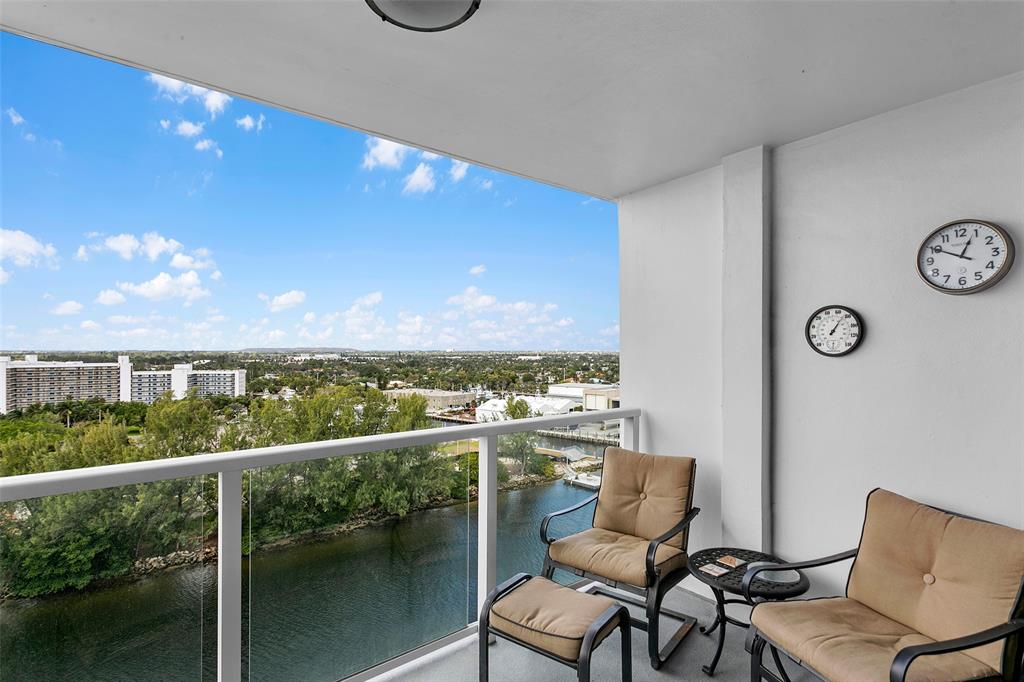 1401 North Riverside Drive, Unit PH1502 Pompano Beach, FL 33062 - Photo 15 of 32 a view of a chairs and table in a balcony