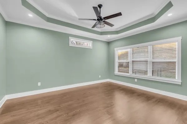 a view of hallway with wooden floor