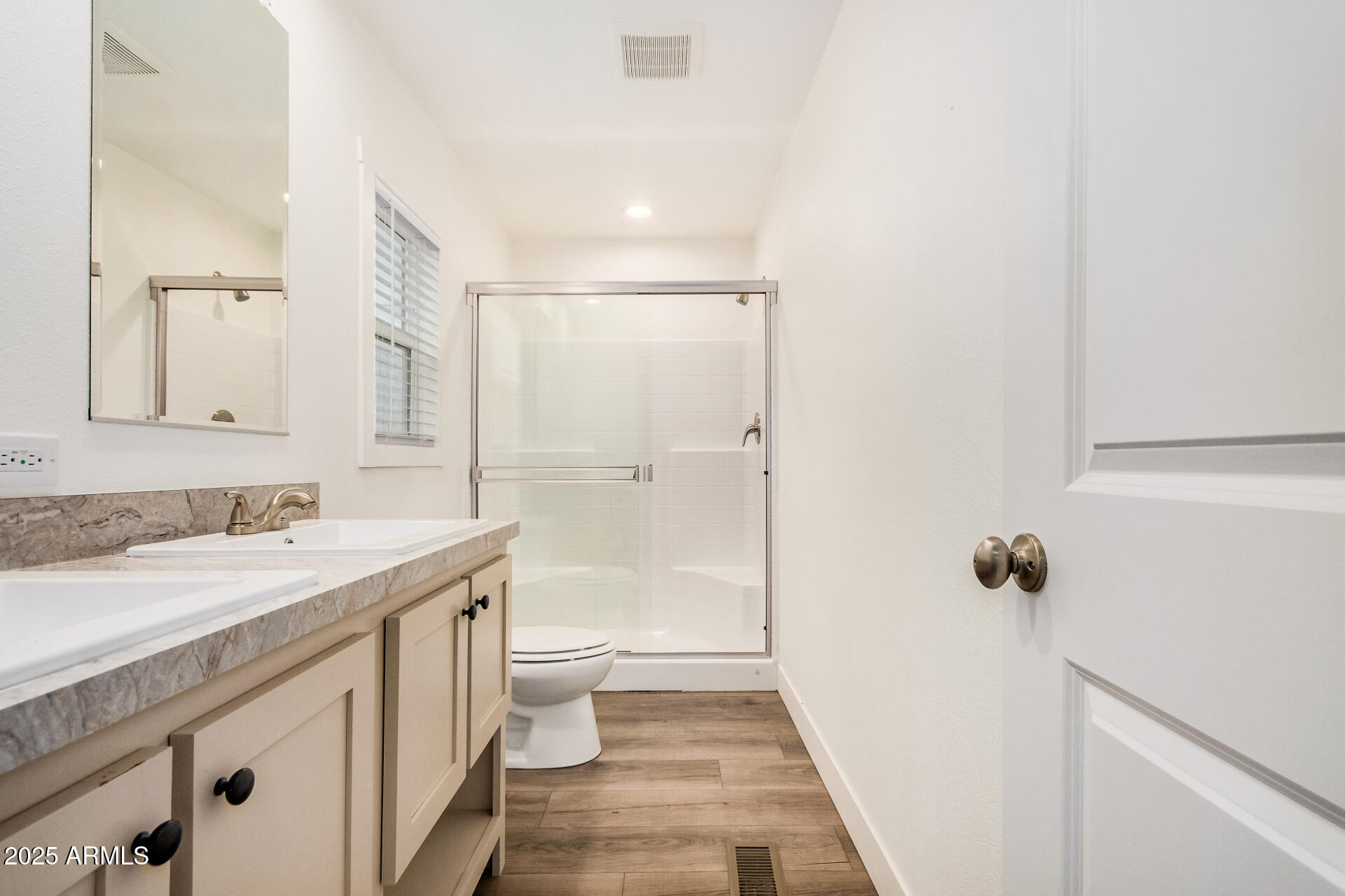 11441 East 4th Avenue Apache Junction, AZ 85120 - Photo 16 of 30 a bathroom with a sink a toilet a shower and a mirror