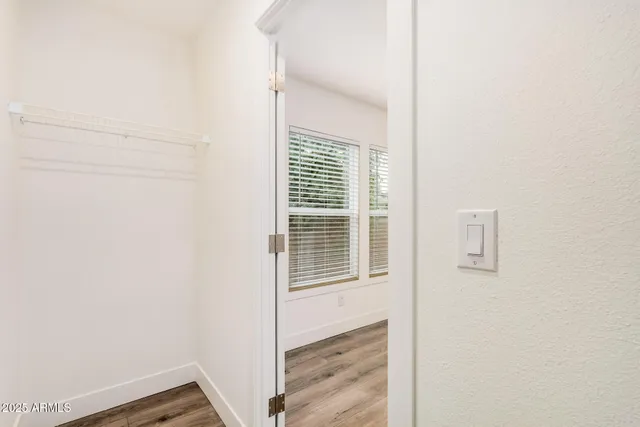 a view of an empty room with a window