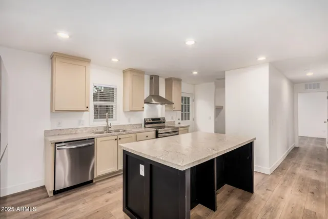 a kitchen with a sink stove and refrigerator