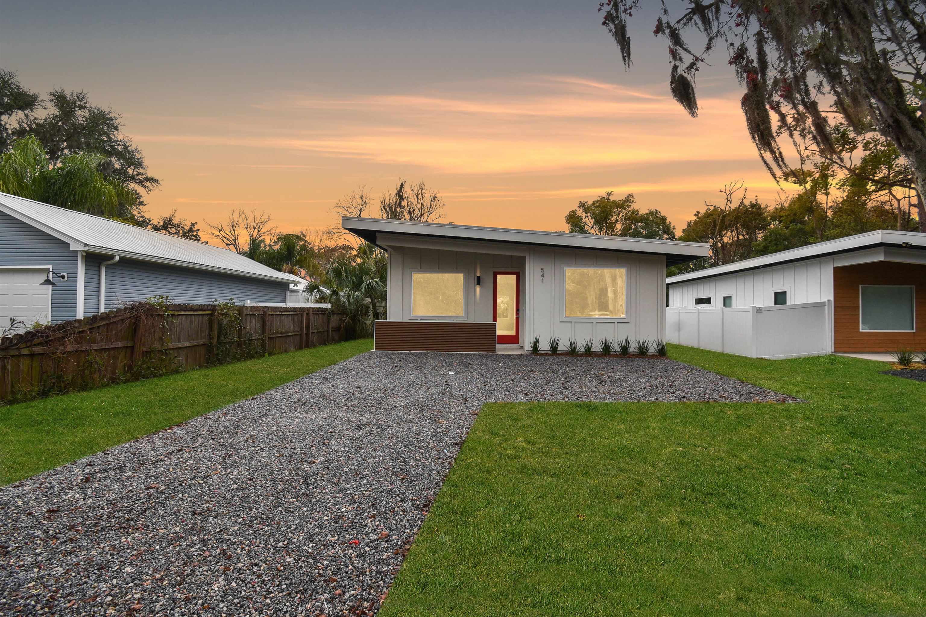 541 Columbus Street St. Augustine, FL 32084 - Photo 1 of 26 a front view of house with a garden