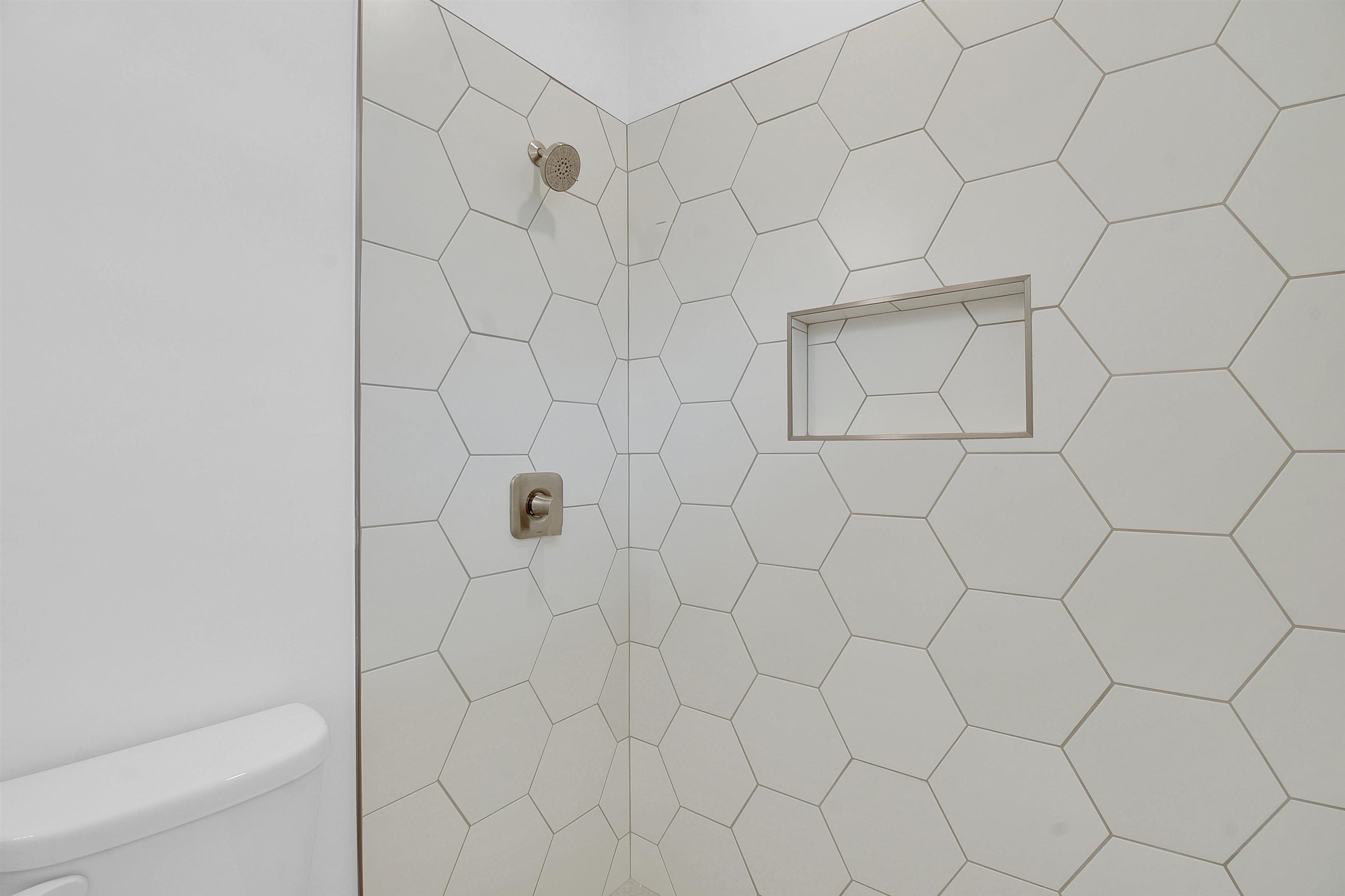 541 Columbus Street St. Augustine, FL 32084 - Photo 14 of 26 a bathroom with a white shower and a white bath tub