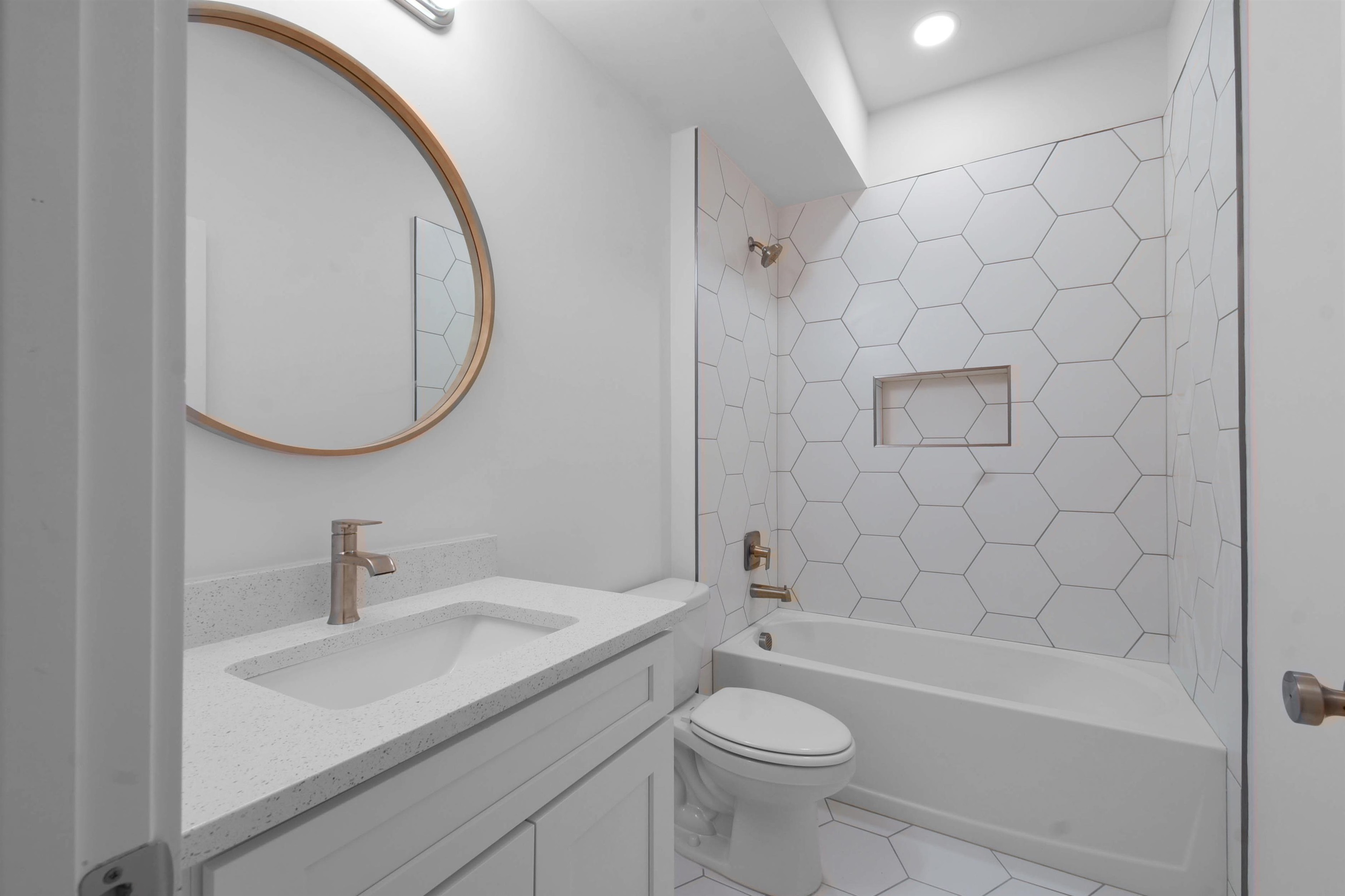 541 Columbus Street St. Augustine, FL 32084 - Photo 21 of 26 a bathroom with a sink a toilet and shower