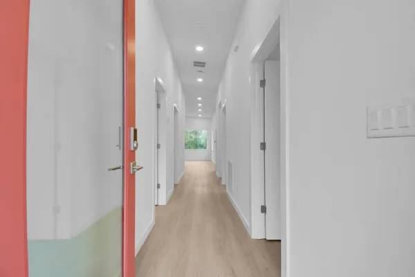 a kitchen with stainless steel appliances a refrigerator sink and microwave