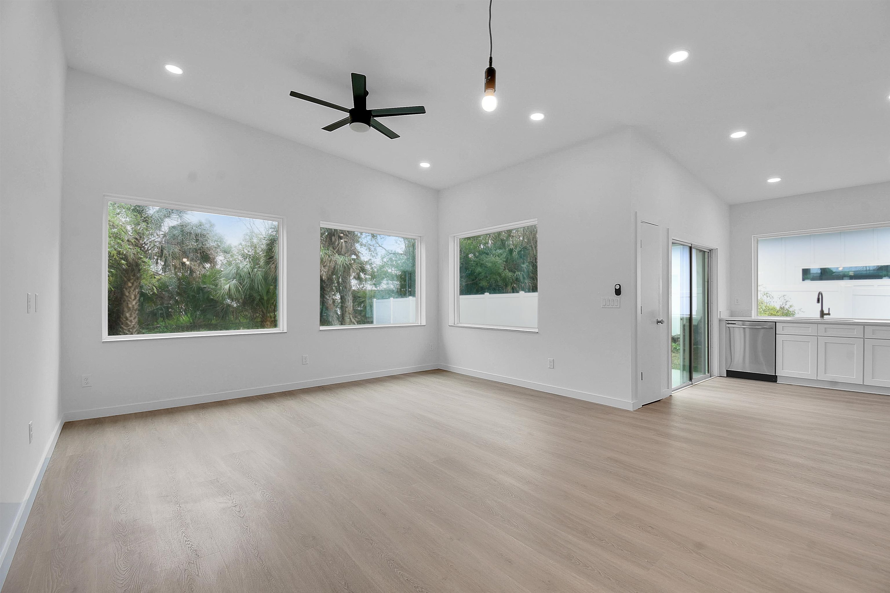541 Columbus Street St. Augustine, FL 32084 - Photo 10 of 26 a view of an empty room with a window and wooden floor