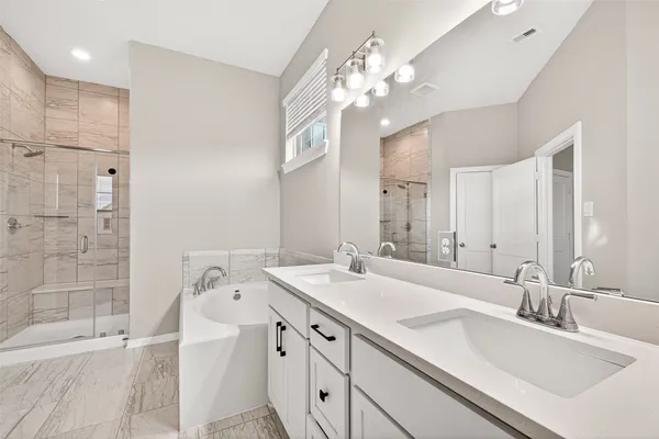 a bathroom with a sink double vanity and a mirror