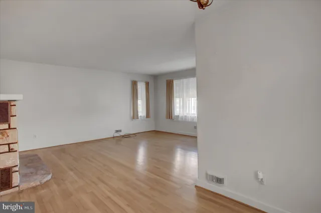 a kitchen with a sink a refrigerator and cabinets
