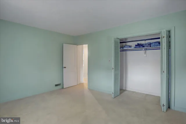 a bathroom with a glass door shower and a sink