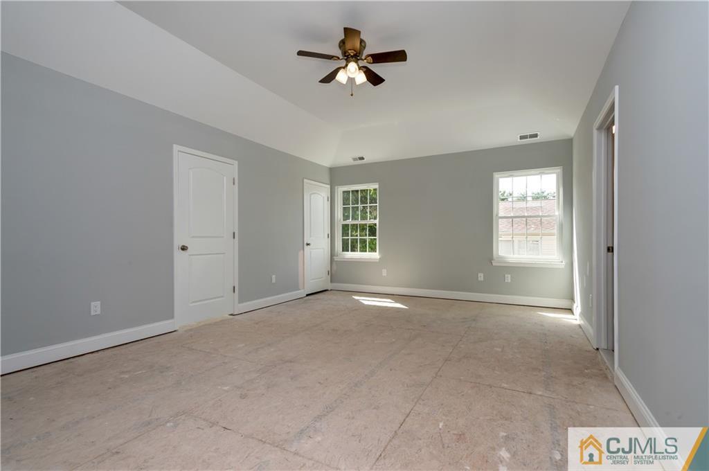 80 Ethel Road Edison, NJ 08817 - Photo 12 of 18 a view of an empty room with a window