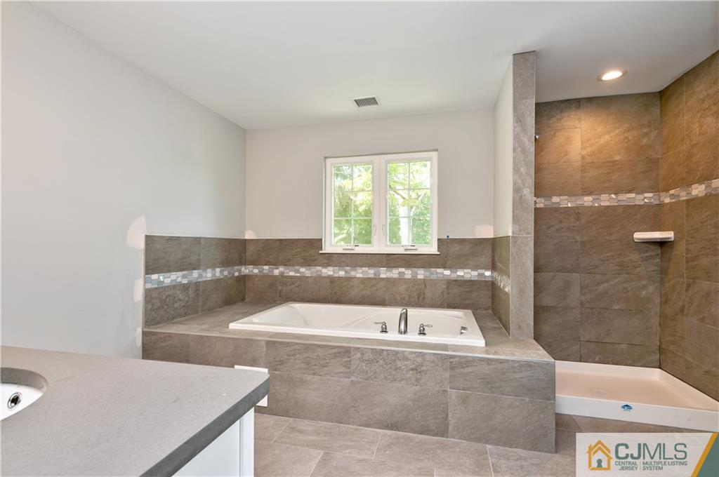 80 Ethel Road Edison, NJ 08817 - Photo 13 of 18 a bathroom with a bathtub and a sink