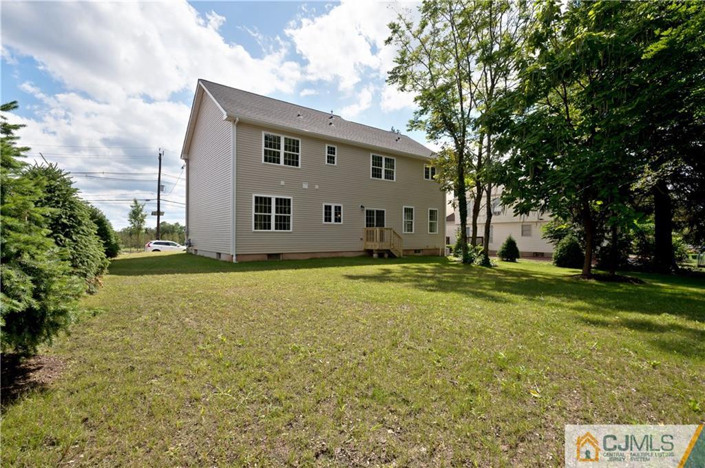 80 Ethel Road Edison, NJ 08817 - Photo 17 of 18 a view of a house with backyard and garden