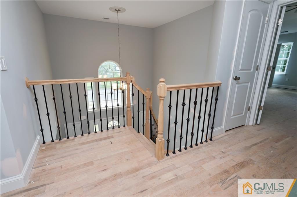 80 Ethel Road Edison, NJ 08817 - Photo 3 of 18 a view of a hallway with a chandelier