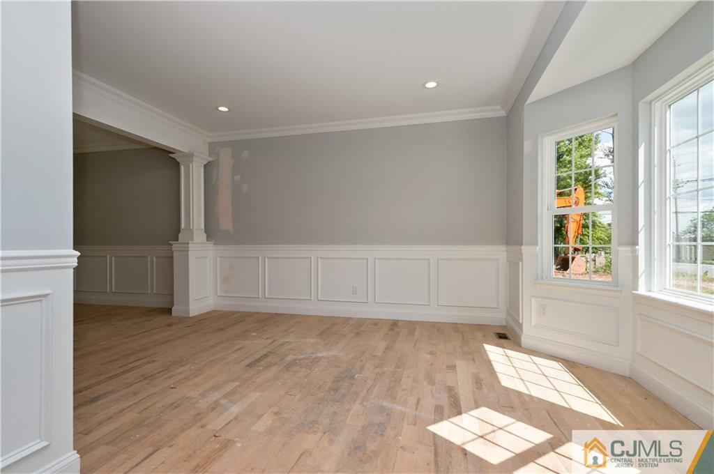 80 Ethel Road Edison, NJ 08817 - Photo 4 of 18 wooden floor in an empty room with a window