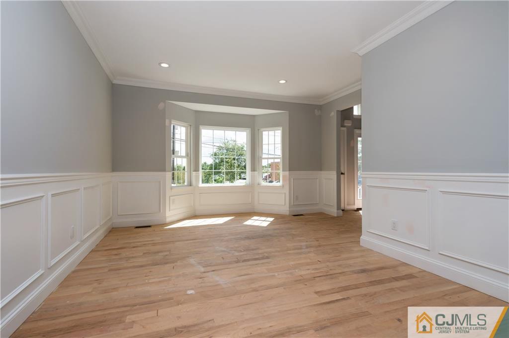 80 Ethel Road Edison, NJ 08817 - Photo 5 of 18 a view of empty room with wooden floor and fan