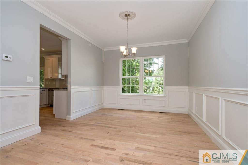 80 Ethel Road Edison, NJ 08817 - Photo 8 of 18 an empty room with windows and entrance