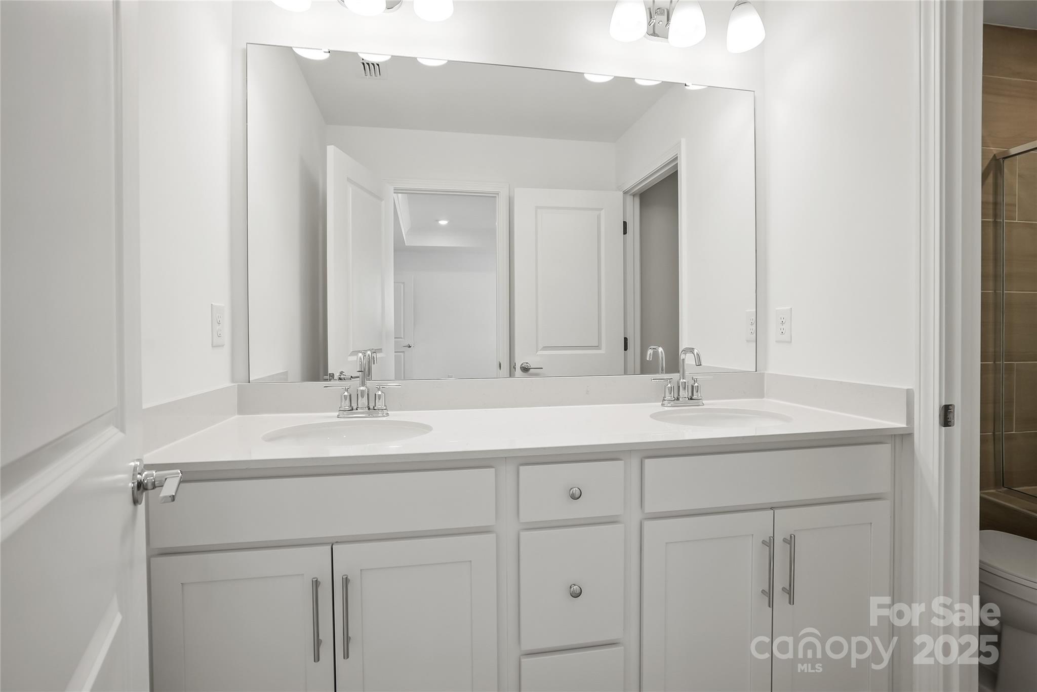 5007 Rill Court, Unit 35 Charlotte, NC 28262 - Photo 19 of 34 a bathroom with a sink and a mirror