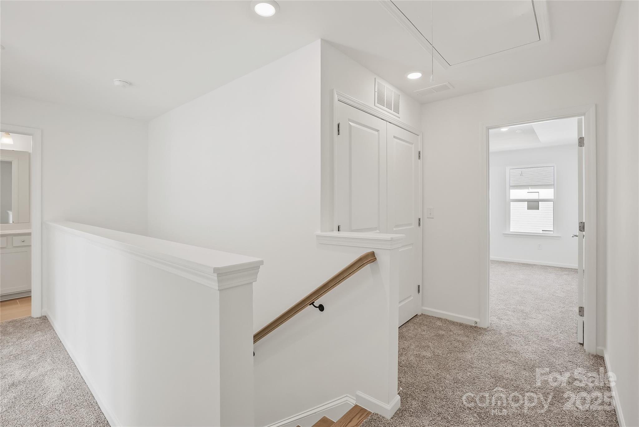 5007 Rill Court, Unit 35 Charlotte, NC 28262 - Photo 23 of 34 a view of a hallway with staircase