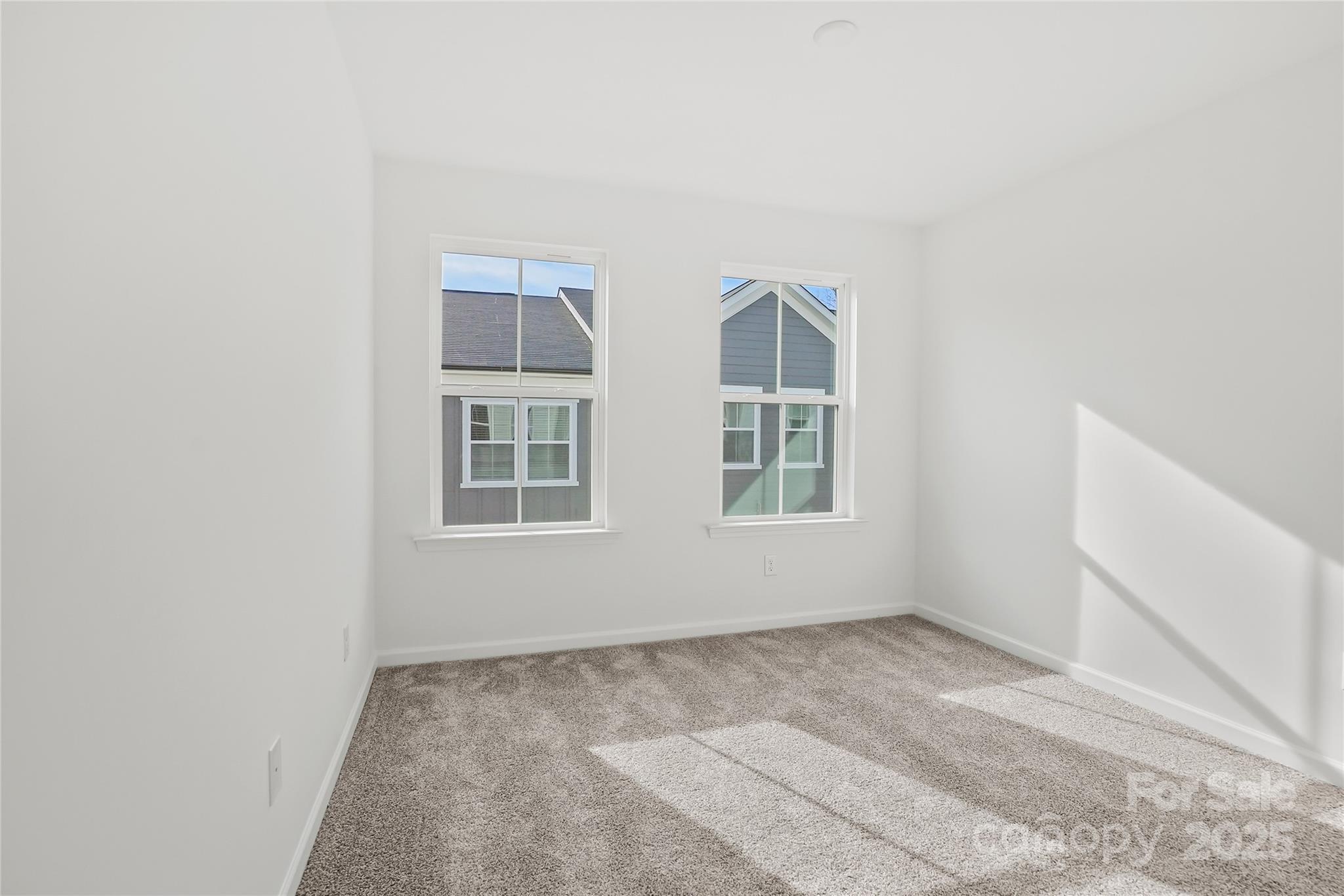 5007 Rill Court, Unit 35 Charlotte, NC 28262 - Photo 27 of 34 an empty room with windows