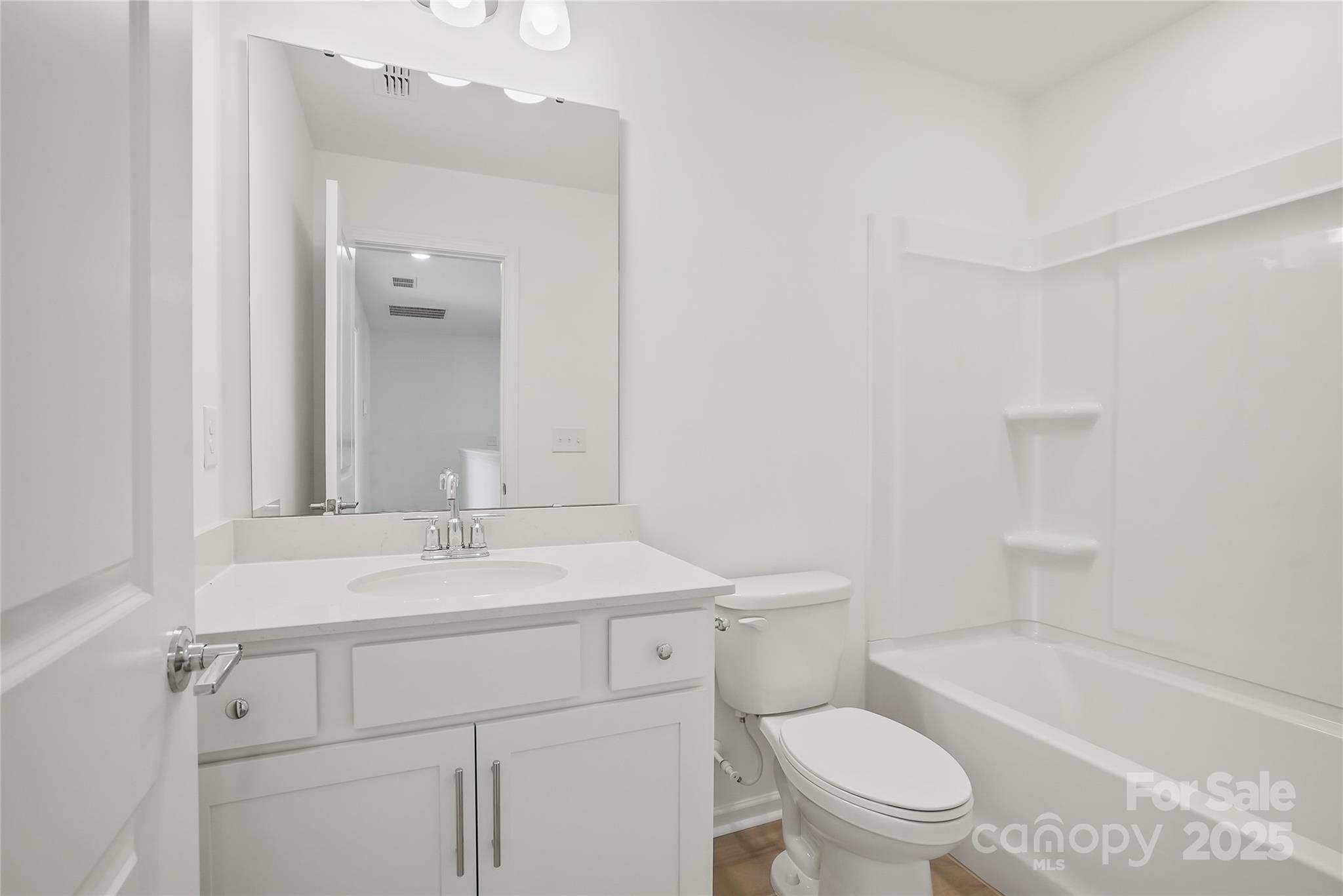 5007 Rill Court, Unit 35 Charlotte, NC 28262 - Photo 29 of 34 a bathroom with a sink a toilet and shower