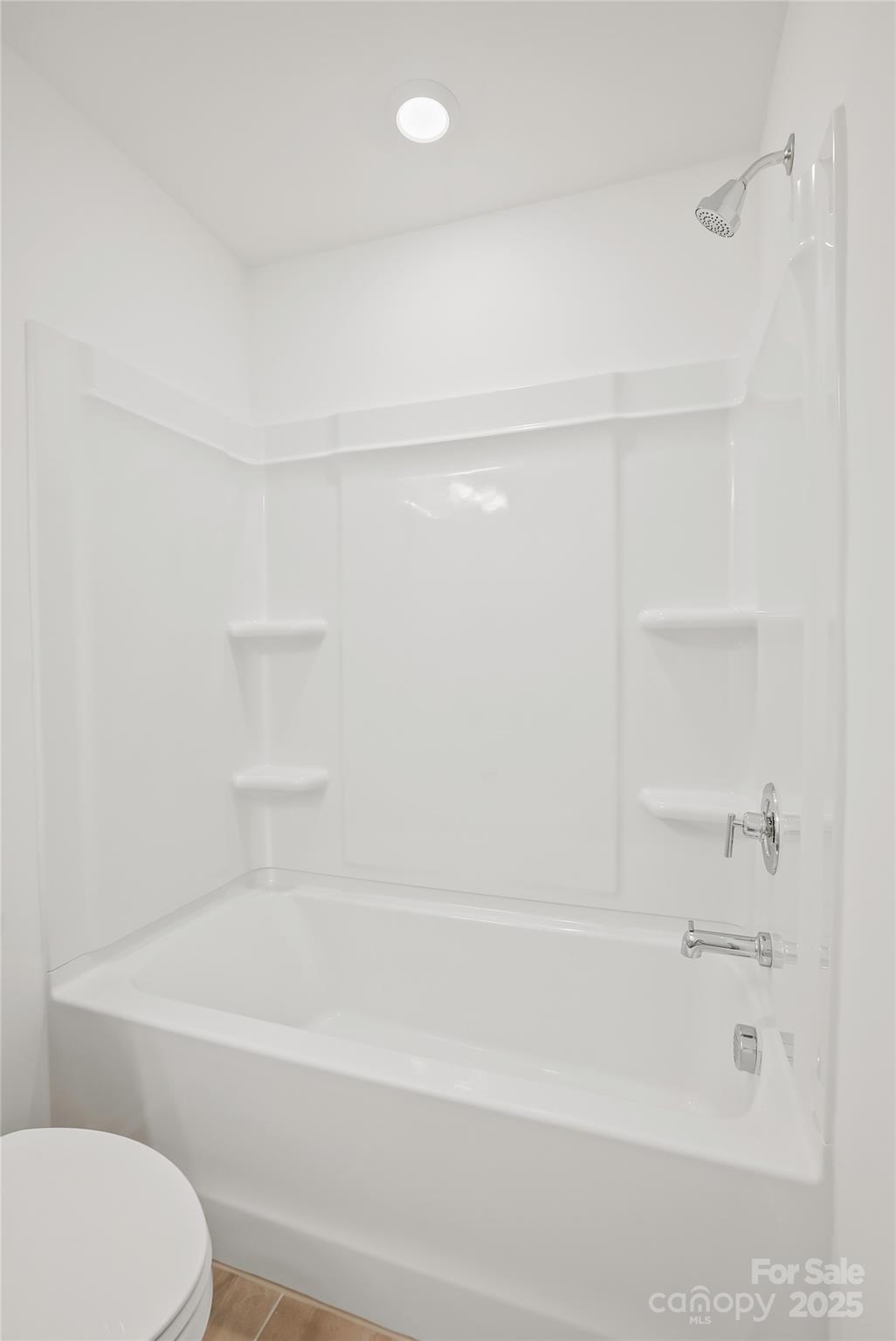 5007 Rill Court, Unit 35 Charlotte, NC 28262 - Photo 30 of 34 a bathroom with a bathtub and a toilet