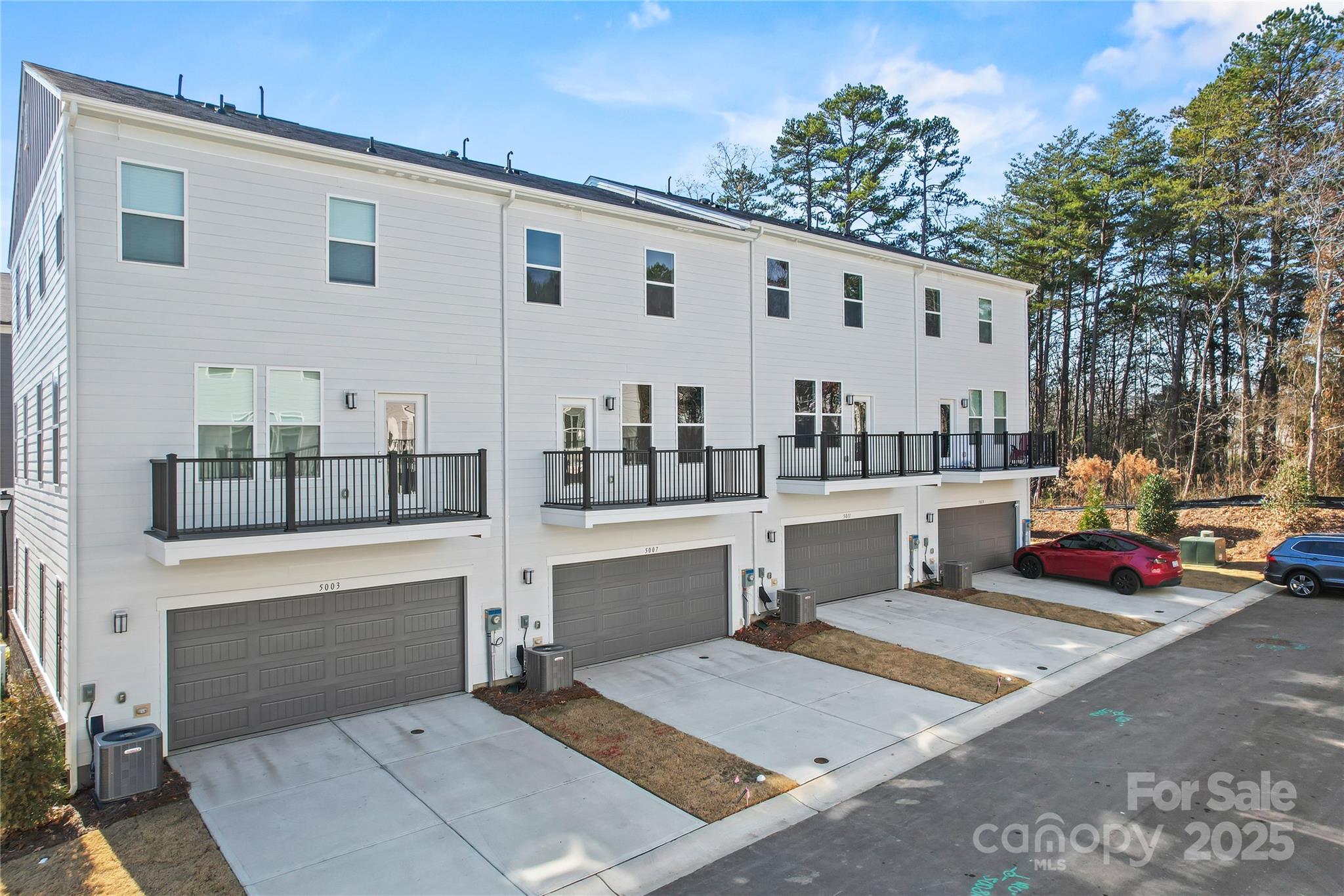 5007 Rill Court, Unit 35 Charlotte, NC 28262 - Photo 32 of 34 a view of house with outdoor sitting space