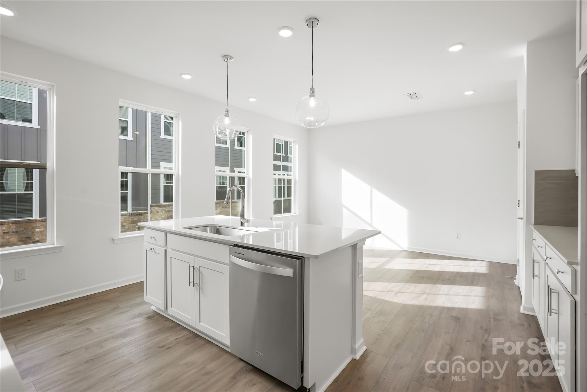 5007 Rill Court, Unit 35 Charlotte, NC 28262 - Photo 8 of 34 a kitchen with a sink and a stove top oven