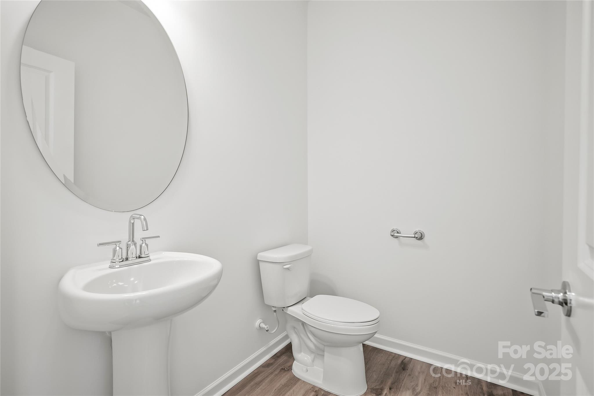 5007 Rill Court, Unit 35 Charlotte, NC 28262 - Photo 10 of 34 a bathroom with a sink and a mirror