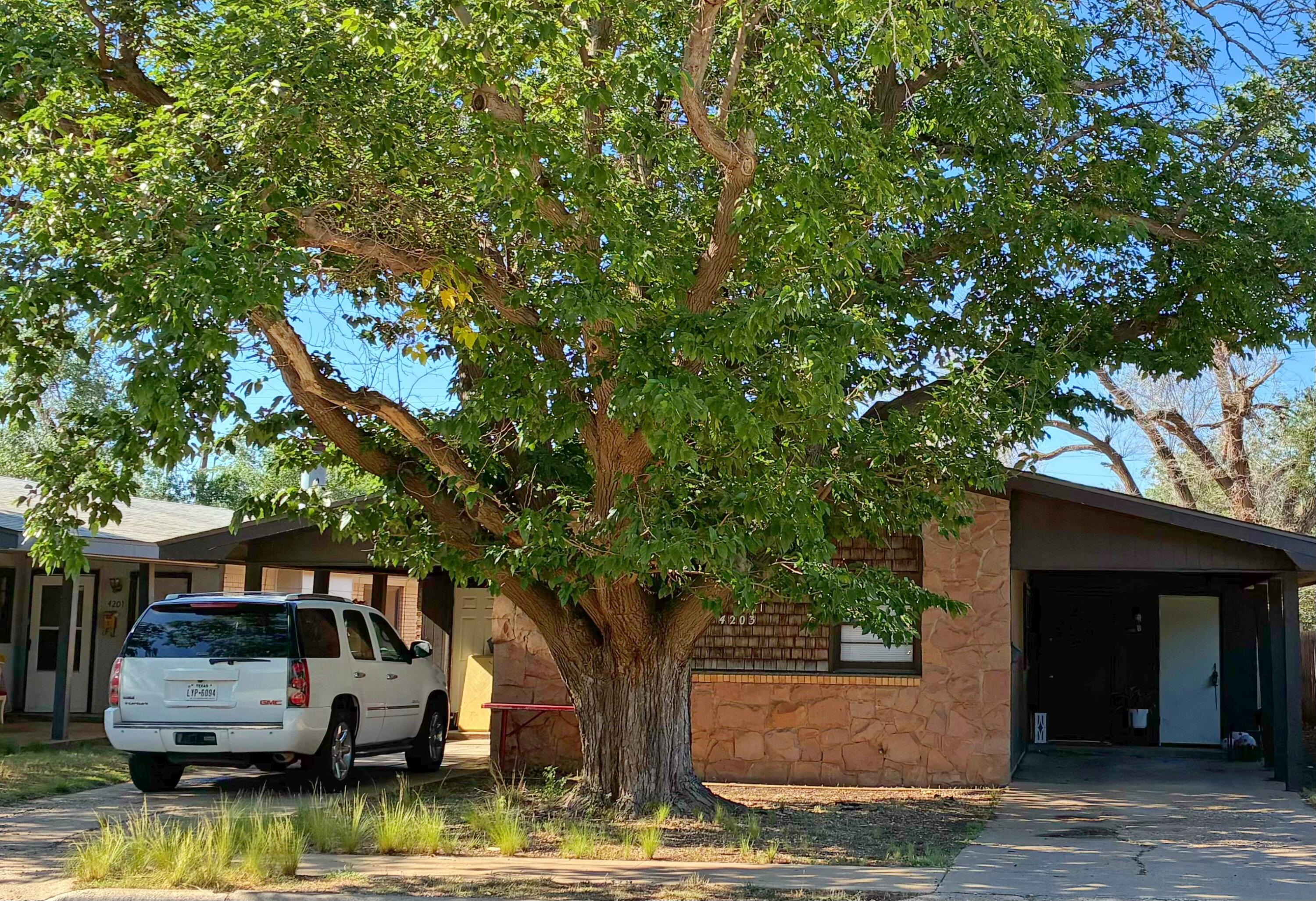 4203 17th Street Lubbock, TX 79416 - Photo 2 of 15 a view of a house with backyard