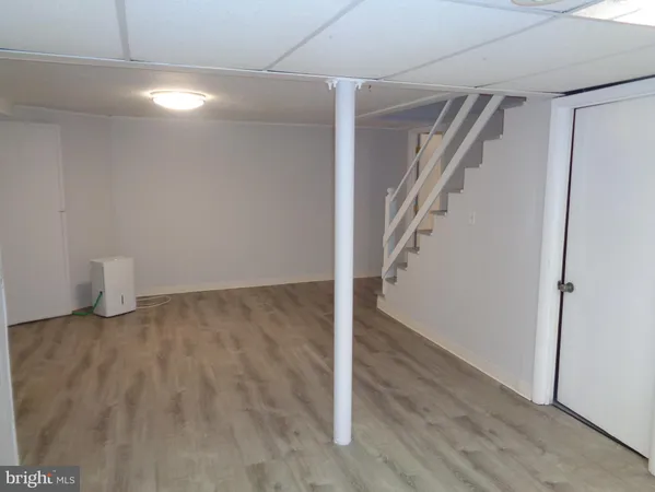 an empty room with closet area