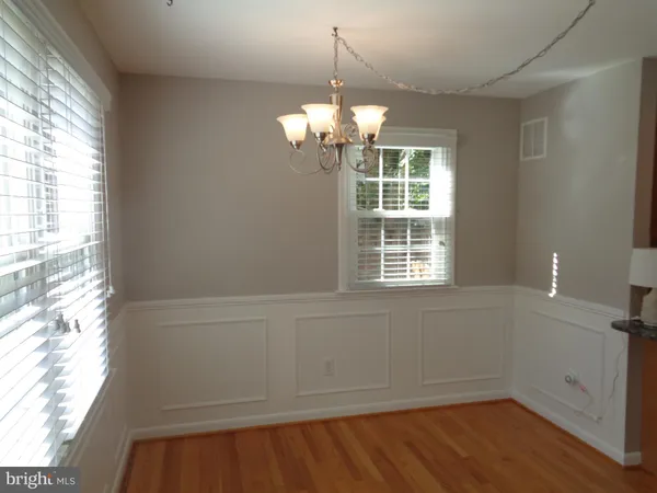 a view of a windows and chandelier in a room