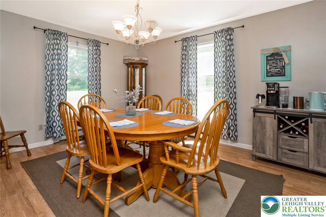 9461 Red Road Kempton, PA 19529 - Photo 13 of 55 A classic chandelier illuminates this elegant dining area, perfectly positioned for everyday meals and special gatherings.