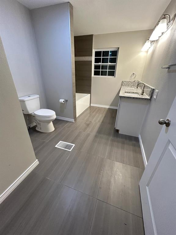 112 Elm Street Roxton, TX 75477 - Photo 11 of 21 a view of empty room with wooden floor and window