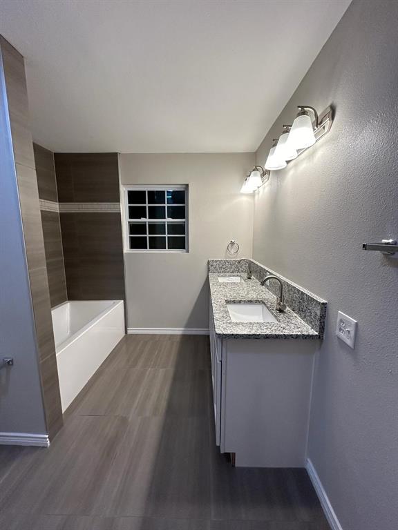 112 Elm Street Roxton, TX 75477 - Photo 12 of 21 a view of a bathroom with a sink and mirror