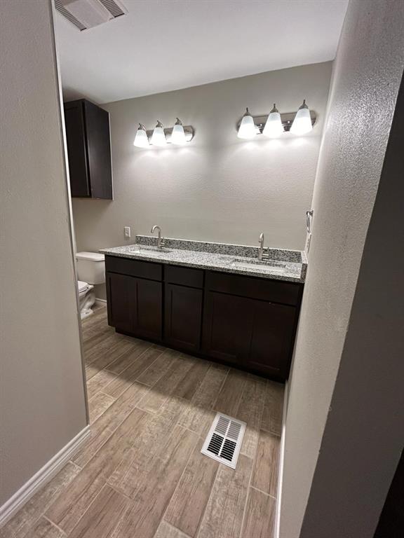 112 Elm Street Roxton, TX 75477 - Photo 15 of 21 a view of living room with granite countertop furniture and lamp