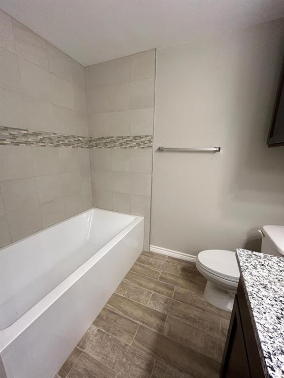 112 Elm Street Roxton, TX 75477 - Photo 16 of 21 a bathroom with a sink a toilet and bathtub