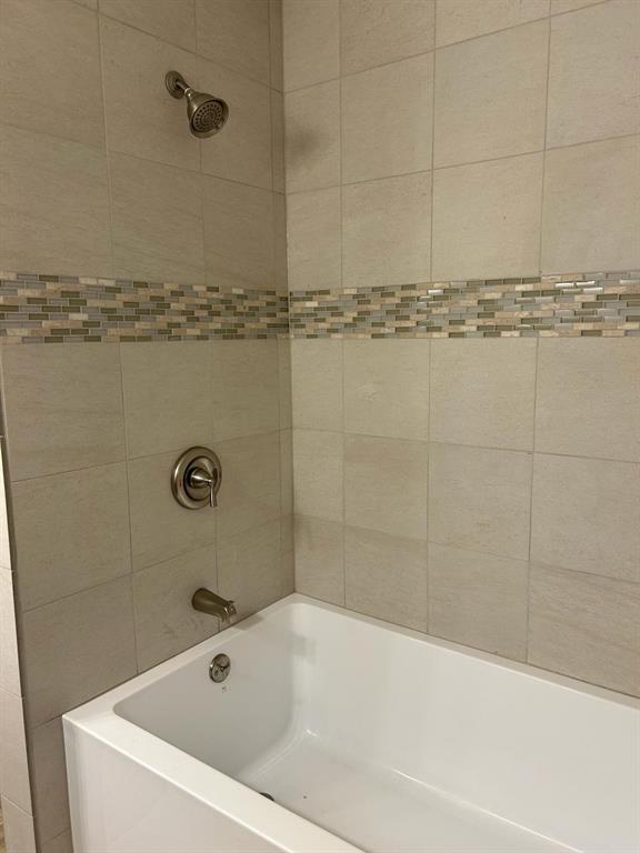 112 Elm Street Roxton, TX 75477 - Photo 17 of 21 a bathroom with a bathtub