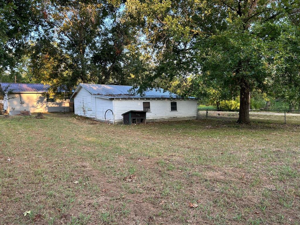 112 Elm Street Roxton, TX 75477 - Photo 19 of 21 a view of a outdoor space with a house