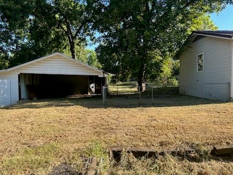 112 Elm Street Roxton, TX 75477 - Photo 21 of 21 a front view of a house with a yard