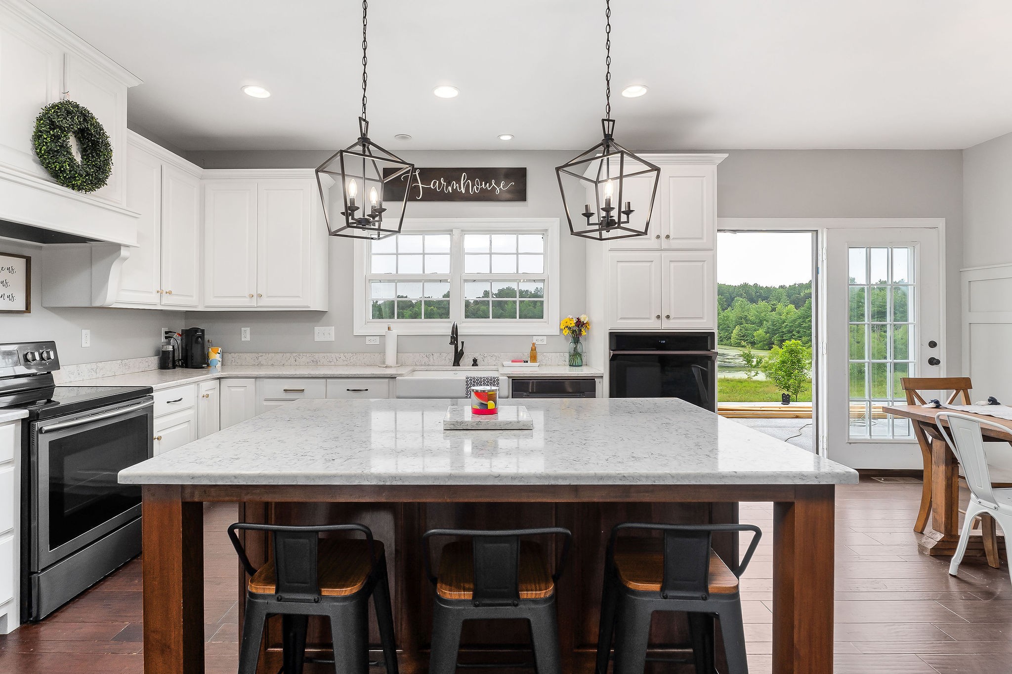 656 Osement Road McMinnville, TN 37110 - Photo 12 of 43 a kitchen with stainless steel appliances a table chairs refrigerator and microwave