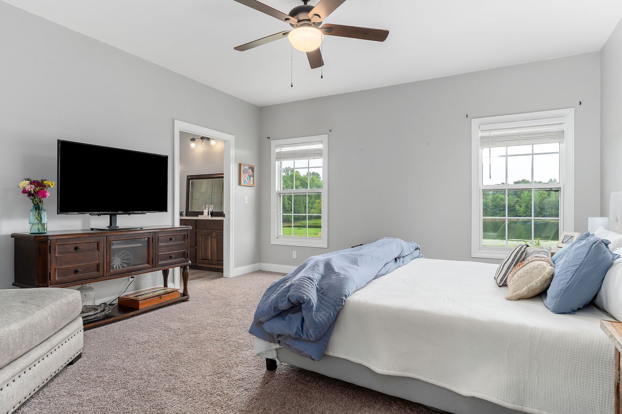 656 Osement Road McMinnville, TN 37110 - Photo 16 of 43 a bedroom with a bed and a flat screen tv