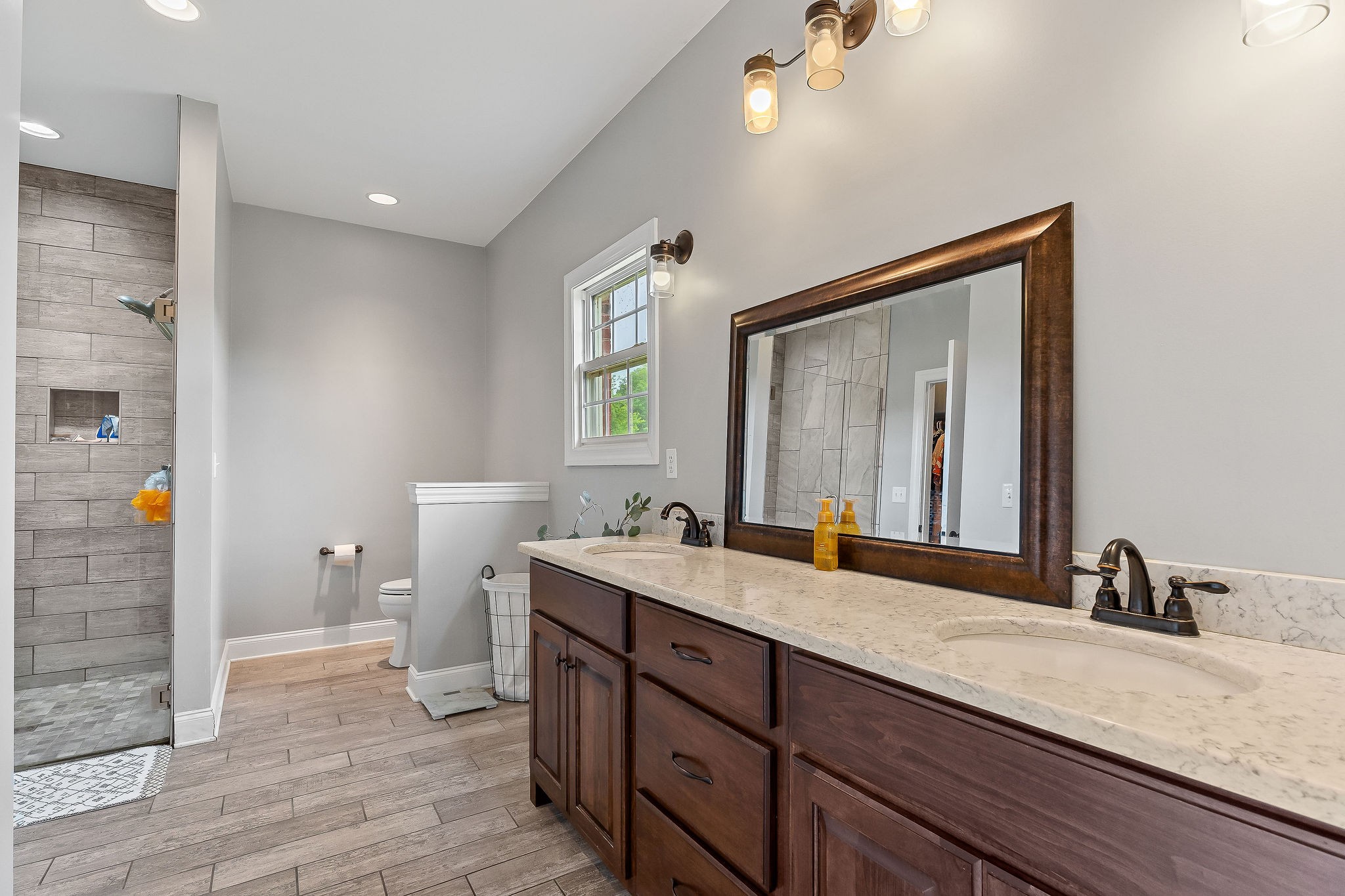 656 Osement Road McMinnville, TN 37110 - Photo 19 of 43 a en suite bathroom with double vanity and a mirror