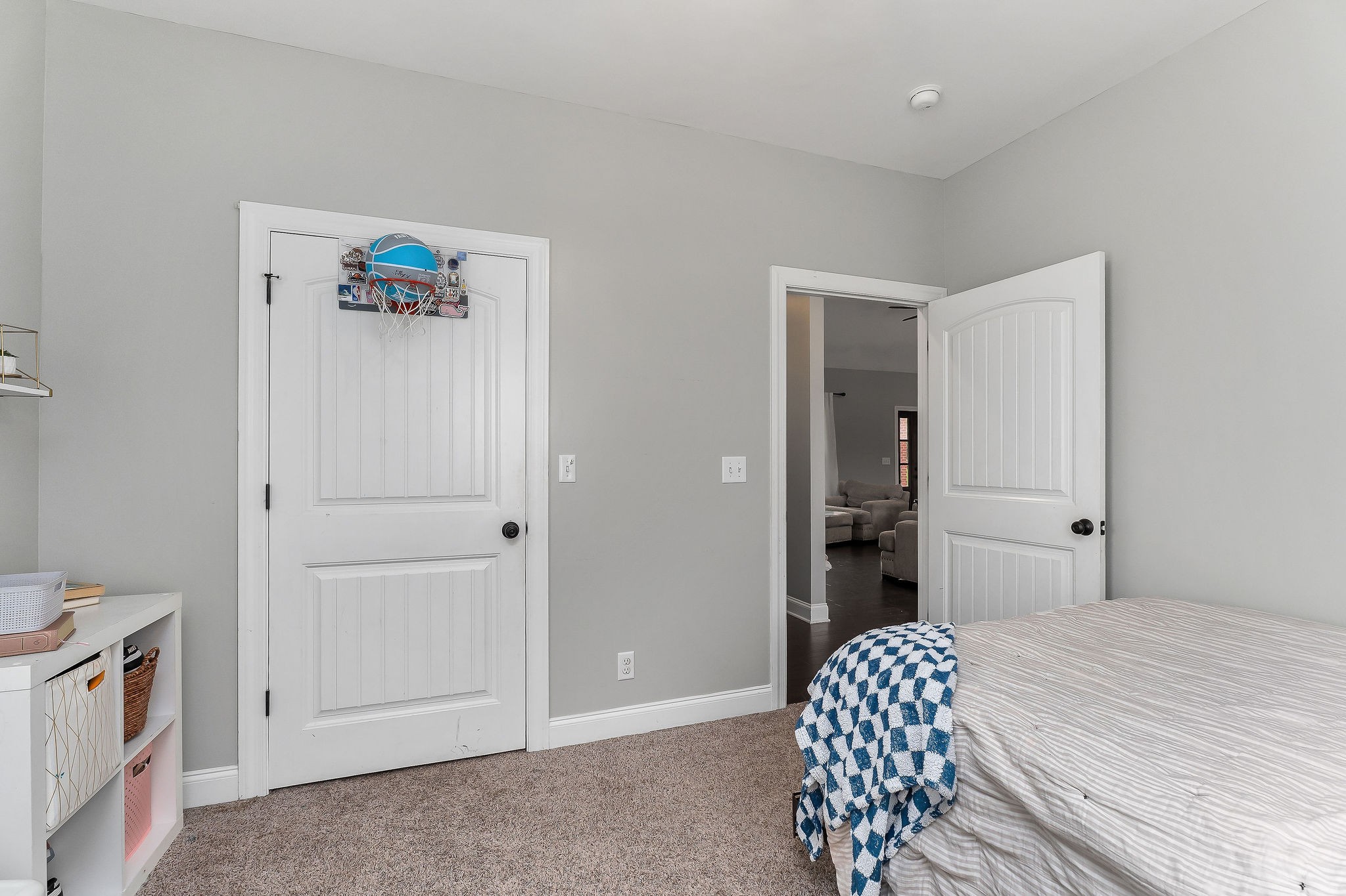 656 Osement Road McMinnville, TN 37110 - Photo 24 of 43 a bedroom with a bed and a chandelier