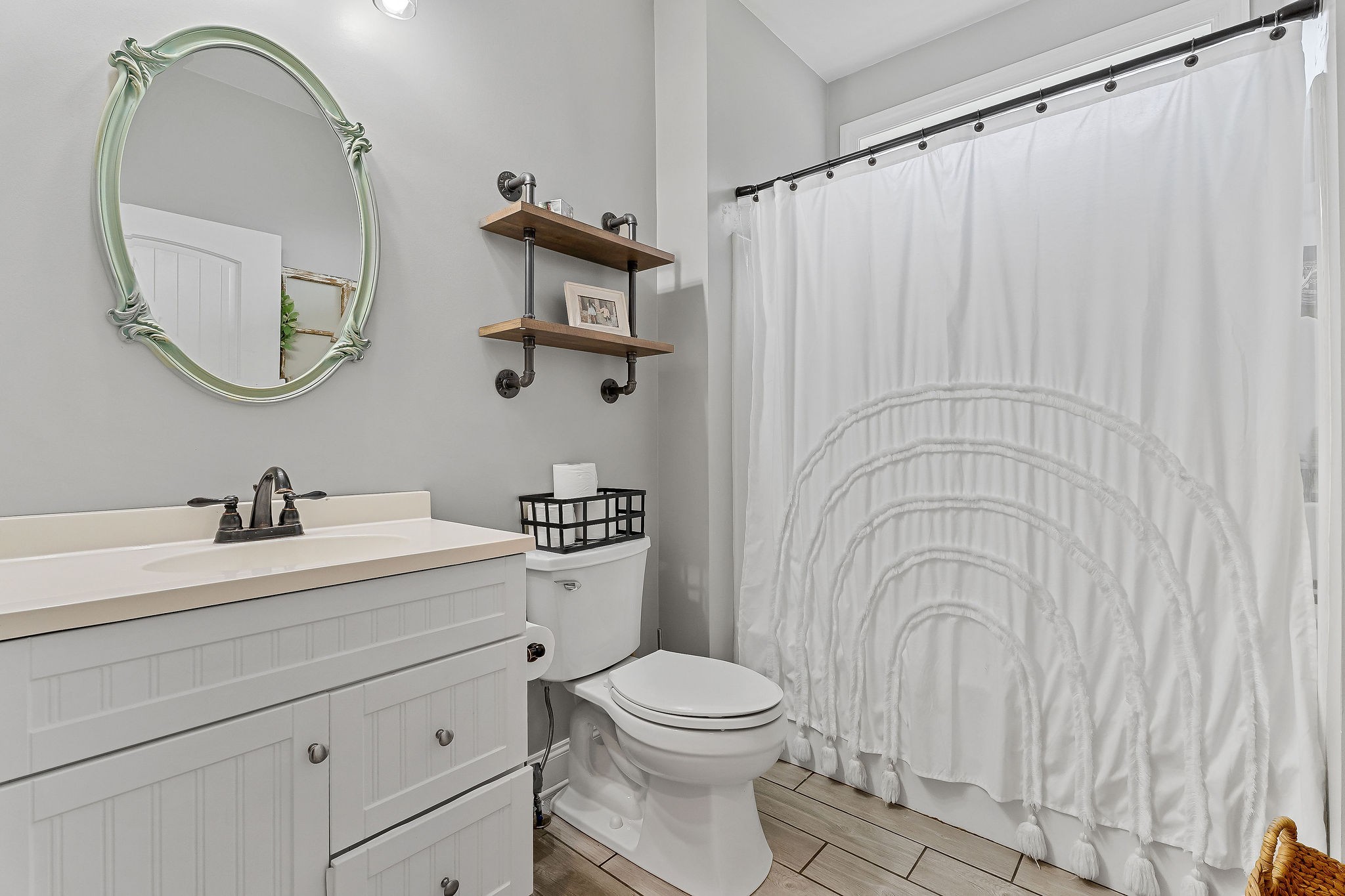 656 Osement Road McMinnville, TN 37110 - Photo 25 of 43 a bathroom with a toilet a sink and a mirror