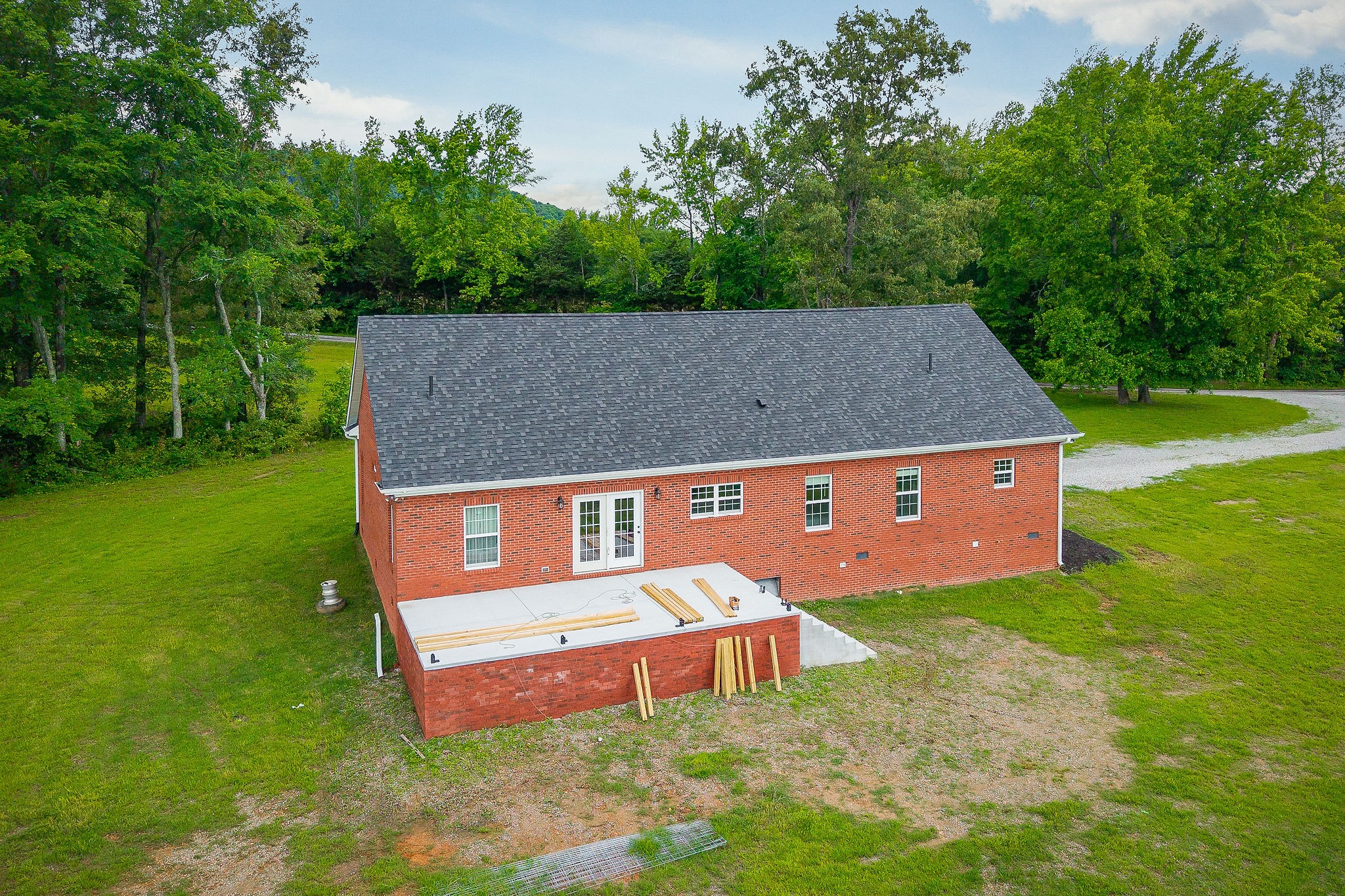 656 Osement Road McMinnville, TN 37110 - Photo 30 of 43 an aerial view of a house with backyard and a garden