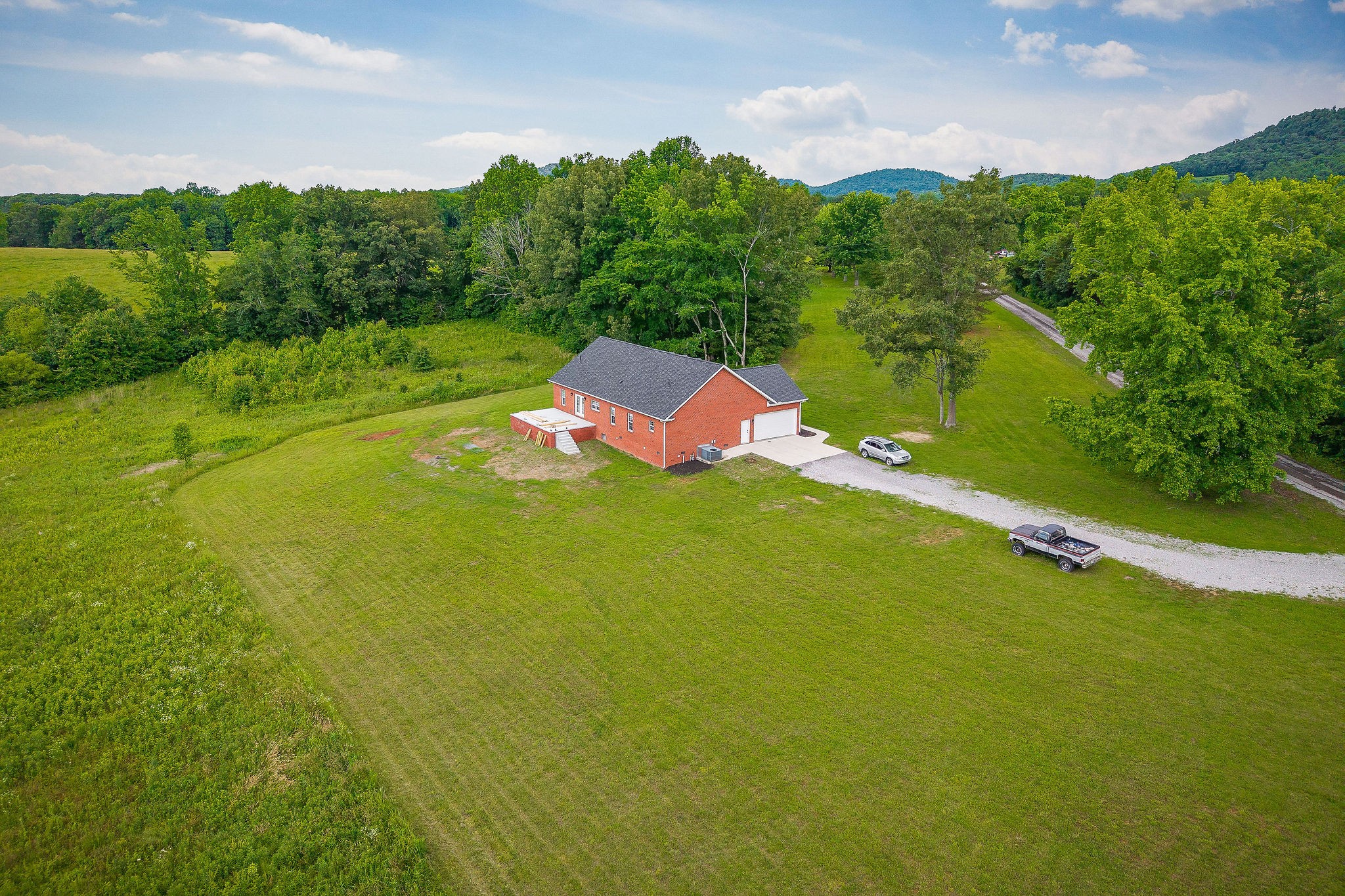 656 Osement Road McMinnville, TN 37110 - Photo 31 of 43 a view of a lake with houses in the background
