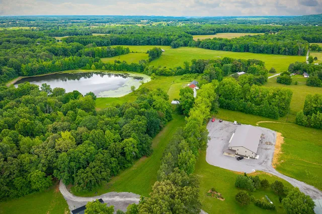 an aerial view of a house with outdoor space and street view