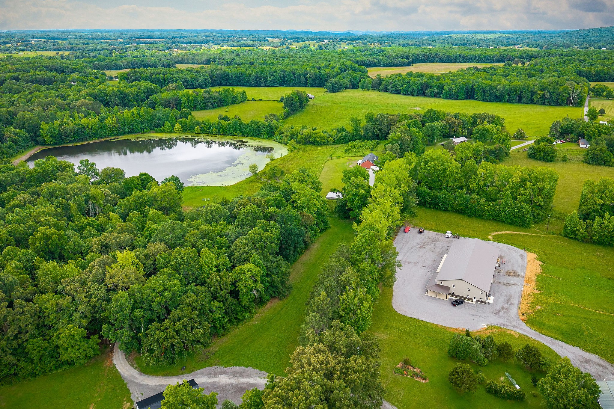 656 Osement Road McMinnville, TN 37110 - Photo 33 of 43 an aerial view of a house with outdoor space and street view