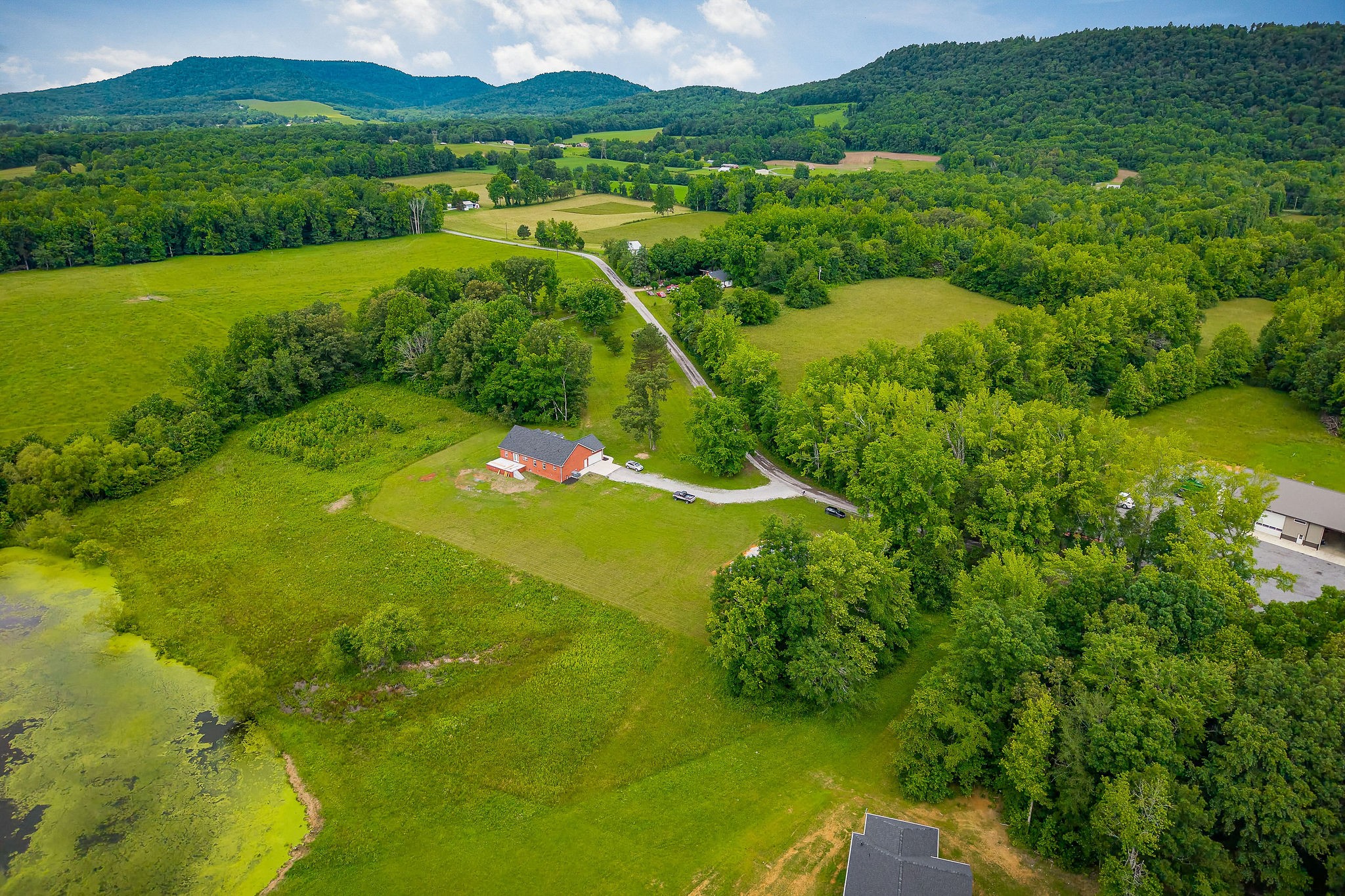 656 Osement Road McMinnville, TN 37110 - Photo 38 of 43 a view of a lake with a houses