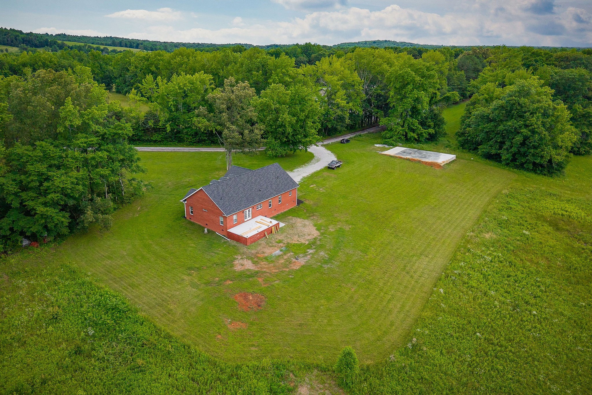 656 Osement Road McMinnville, TN 37110 - Photo 39 of 43 a view of a green yard with large trees